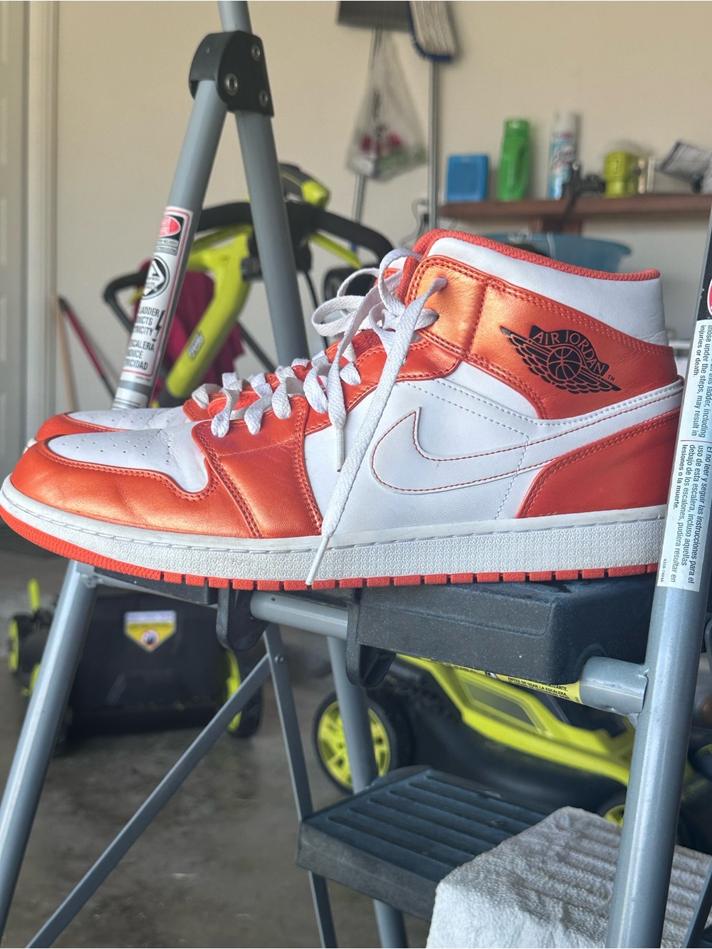Jordan Air Jordan 1 Mid White and Metallic Orange Sneakers